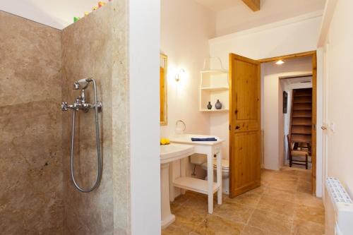 a bathroom with a shower and a sink at Can Cremat in Port de Pollensa