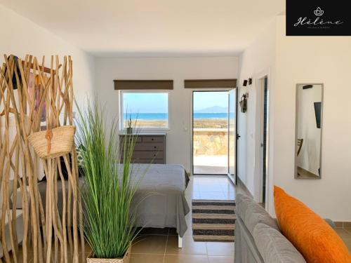 a living room with a bed and a couch at Hélène Holidays - Hotel Boutique in Corralejo