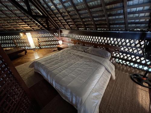 Tempat tidur dalam kamar di hacienda del mar