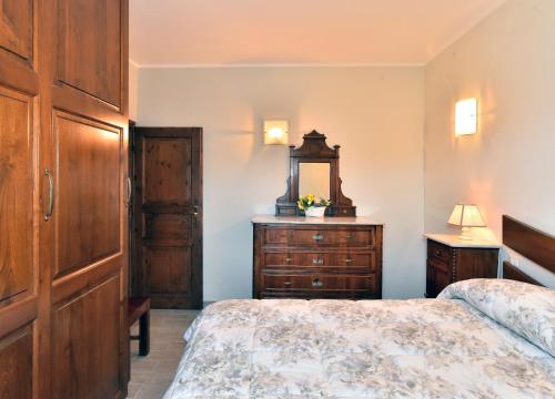 Ένα ή περισσότερα κρεβάτια σε δωμάτιο στο La Casetta Della Nonna