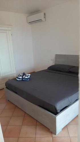 Postel nebo postele na pokoji v ubytování Appartamento Residence Mirice Vignola mare Aglientu casa Mattia