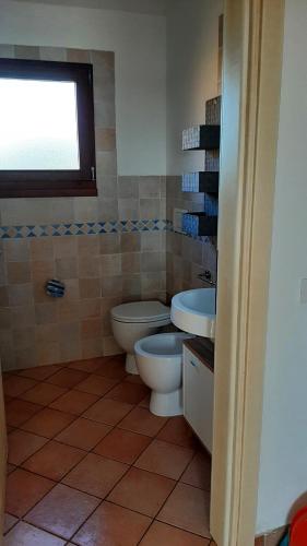 Koupelna v ubytování Appartamento Residence Mirice Vignola mare Aglientu casa Mattia
