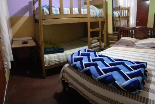 Ένα ή περισσότερα κρεβάτια σε δωμάτιο στο Hostal Jovita
