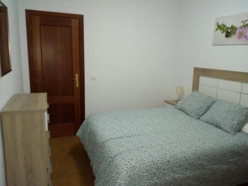 Łóżko lub łóżka w pokoju w obiekcie Apartamento buena vista