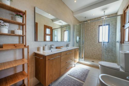 a bathroom with a sink and a shower at Sunny House in Loulé