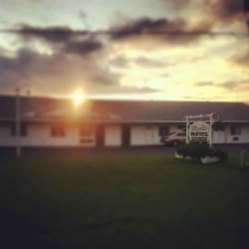 a building with a sign in front of it at Village Inn Motel in Chatham