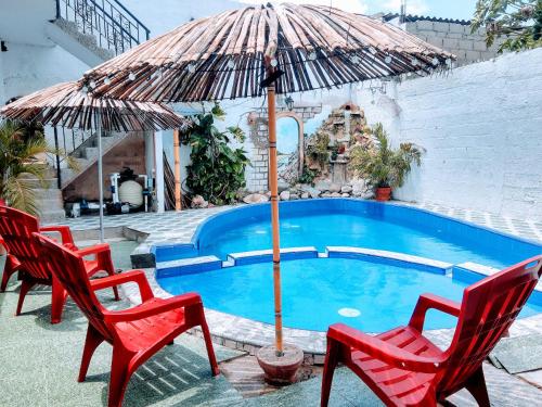 Swimmingpoolen hos eller tæt på Hostal Solsticio Guajiro