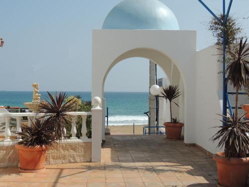 a white building with a view of the ocean at Virgen del Mar Holidays in Mojácar