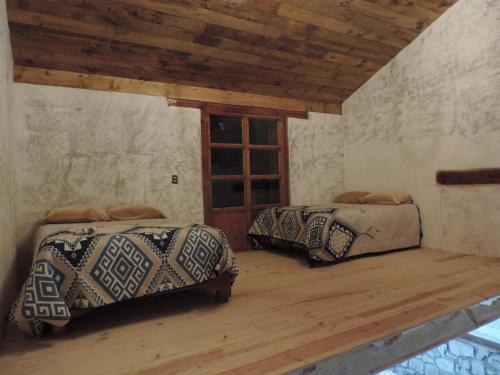 Postel nebo postele na pokoji v ubytování Antigua Hacienda Metepec