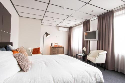 Cama o camas de una habitación en Parkstad City Hotel
