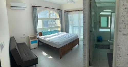 Postel nebo postele na pokoji v ubytování Sea Man Homestay