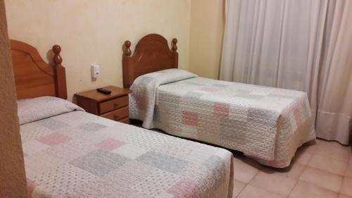 Letto o letti in una camera di Hostal Avi Pep