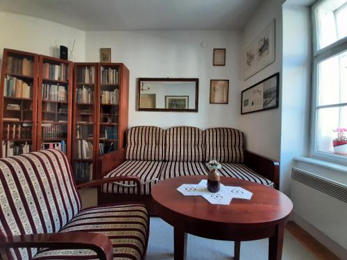 a living room with a couch and a table at Apartment History in Zagreb