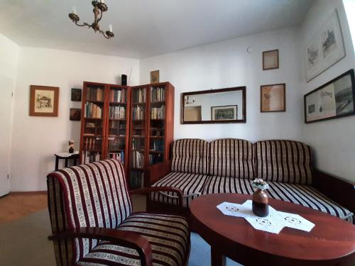 a living room with a couch and a table at Apartment History in Zagreb