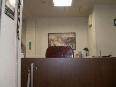 an office with a desk and a chair in a room at Ikawa Ryokan in Hiroshima