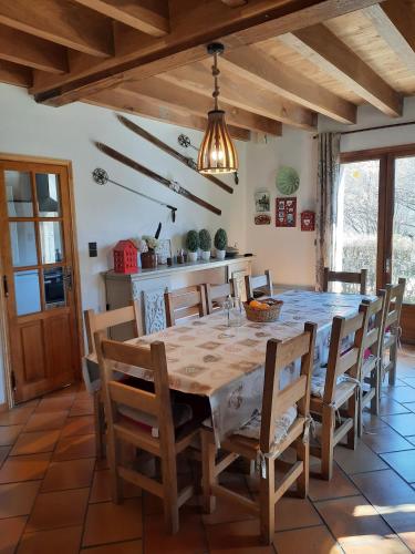 a dining room with a table and chairs at La Grange Des Biches in Benque-Dessous-et-Dessus