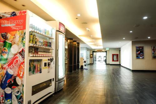 an empty hallway of a store with a refrigerator at The Twin Lotus Hotel in Nakhon Si Thammarat