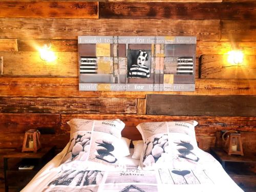 a bedroom with a bed in a wooden wall at Cortijo Boutique Marbella in Marbella