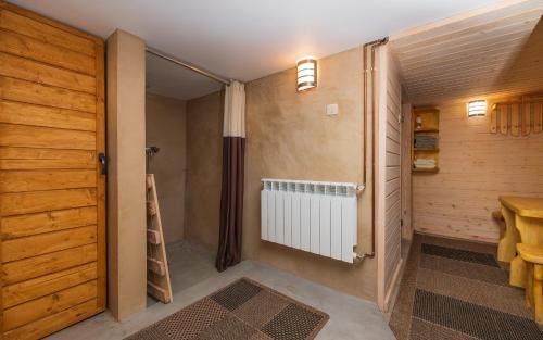 a small room with a closet and a radiator at Dom nad Narwią in Wyszki