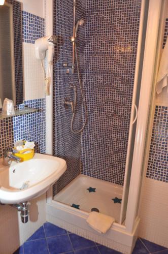 a bathroom with a shower and a sink at Roma Gianicolense in Rome