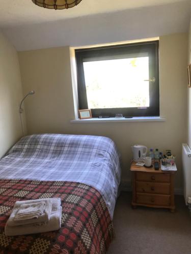 Ένα ή περισσότερα κρεβάτια σε δωμάτιο στο Stoke House Bed and Breakfast