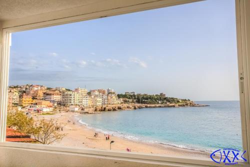 a view of a beach from a window at Apart Hotel XXL Lux in Dobra Voda