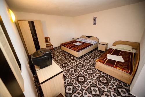 Ένα ή περισσότερα κρεβάτια σε δωμάτιο στο Vila Dora