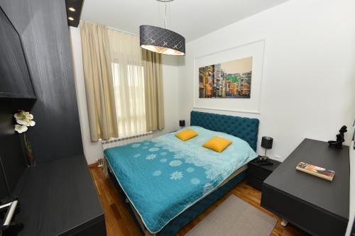 Ένα ή περισσότερα κρεβάτια σε δωμάτιο στο Grand Lux apartman