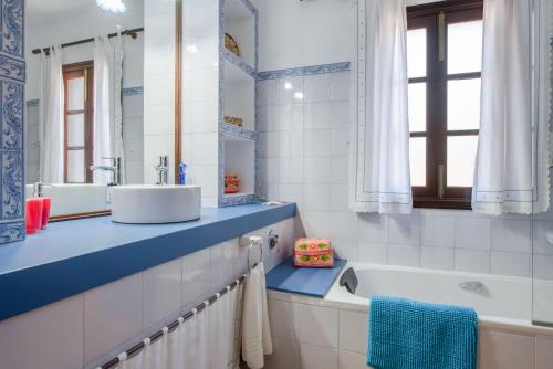 a bathroom with a sink and a bath tub at Sa Vinyeta in Artá