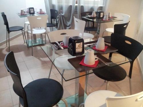 a restaurant with chairs and tables and tables with candles on them at Del Cavaliere in Castrovillari
