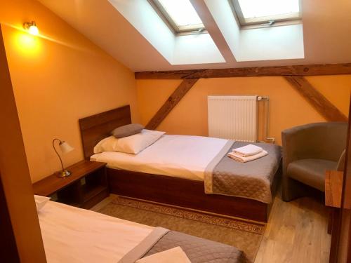 Cama o camas de una habitación en Hotelik Polonia