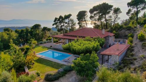 an aerial view of a house with a swimming pool at villa fairytale in Nerotriviá