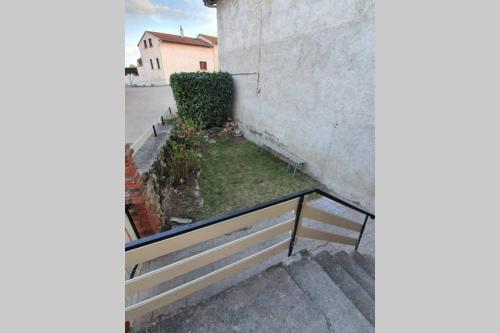 a stairway with a bench next to a building at PETIT COCON in Boisset-Saint-Priest