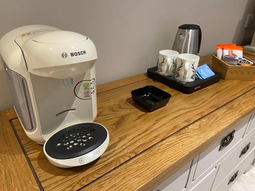 a coffee maker sitting on top of a counter at Kirkwirral Bed & Breakfast in Dumfries