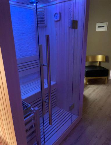 a room with a glass door with a pool in it at Palazzo Otello 1847 Wellness & Spa in Vicenza