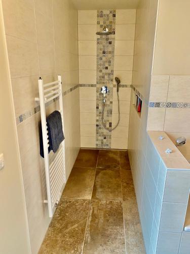 a bathroom with a shower and a sink at Haus Meerruhe Karlshagen Apartment 1-6 in Ostseebad Karlshagen