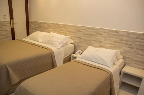 Ένα ή περισσότερα κρεβάτια σε δωμάτιο στο Hotel Costa do Atlântico