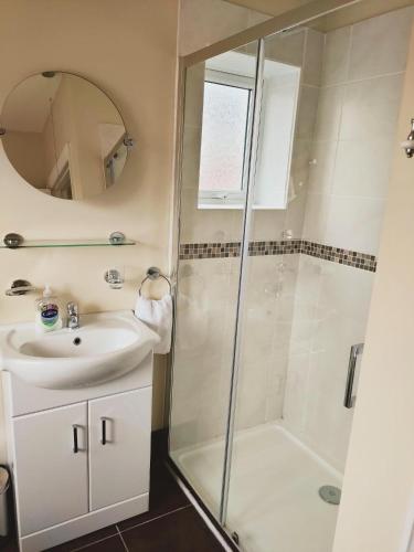 a bathroom with a shower and a sink at The Bays in Bridlington