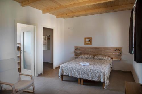 A bed or beds in a room at Agriturismo Casa Matilde