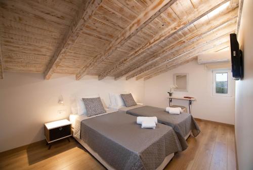 Uma cama ou camas num quarto em Sole di Corfu