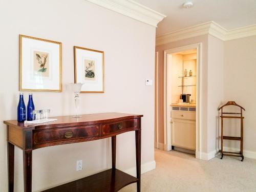 a wooden desk in a room with a kitchen at Copper Beech Inn in Ivoryton