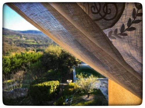 a close up of a window with a view at La Providence in Apt