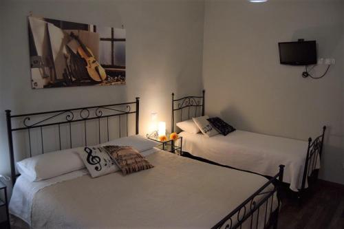 Кровать или кровати в номере Segui le note della Tua vita