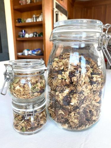 two glass jars filled with nuts on a table at Northey Street House in Salem