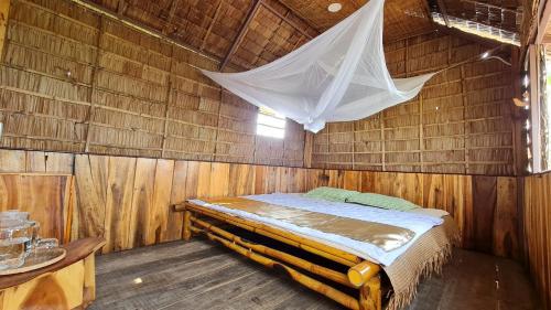 Кровать или кровати в номере Việt Mekong Farmstay