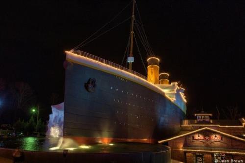 a large boat sitting in the water at night at Smokey Max Cabin in Pigeon Forge