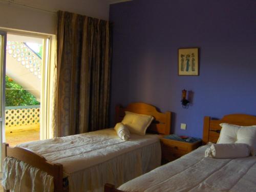 A bed or beds in a room at Vila Sodré Guest House