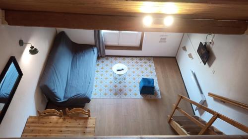 an overhead view of a room with a staircase in a house at Appartement Sainte Marie de Campan - Résidence le Vieux Village in Sainte-Marie-de-Campan