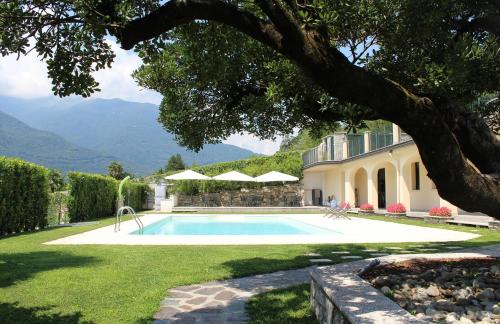 a swimming pool in the yard of a house at Oleandro 1 apartment in Villa Cerutti in Mergozzo