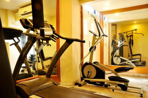 a gym with several exercise bikes in a room at Royal Fort Hotel in Visakhapatnam